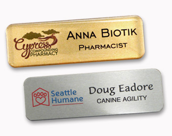 Two metal name tags with UV color logos.